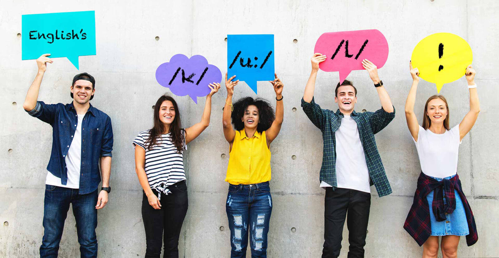 young professionals holding colourful speech bubbles on pale background