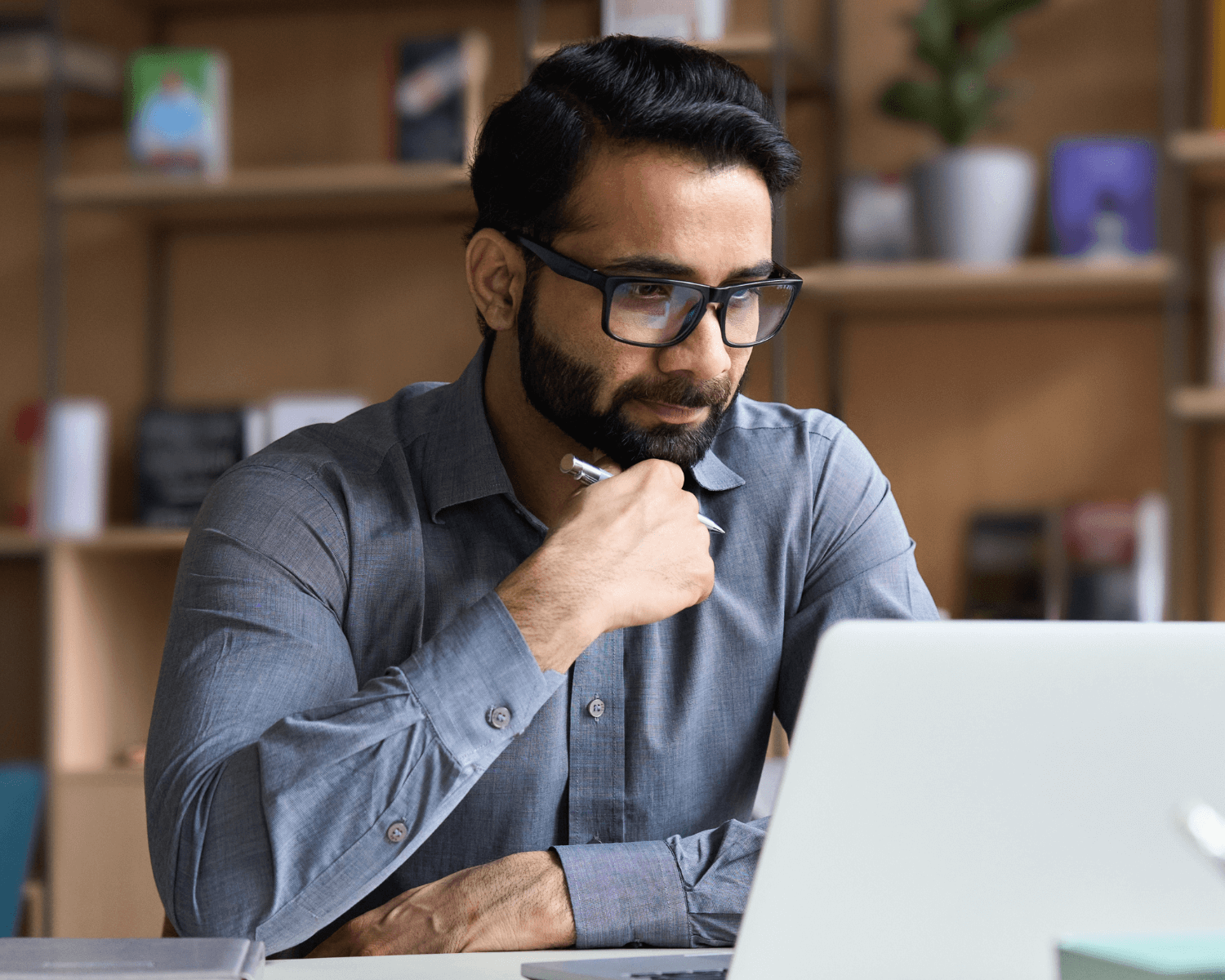 man sitting in front of laptop